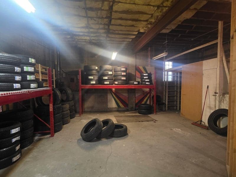 New and used tires stocked on the racks at BuySell Tires in Lethbridge, AB